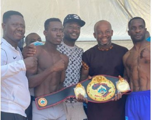 John Laryea with Asamoah Gyan, Sammy Anim and his opponent Sebastianus Natanael at the presser