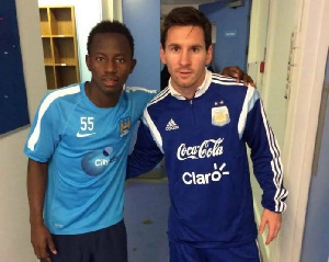 Yaw Yeboah with Lionel Messi