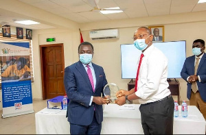 The Deputy Minister for Education, John Ntim Fordjour presents award to Management of GTEC