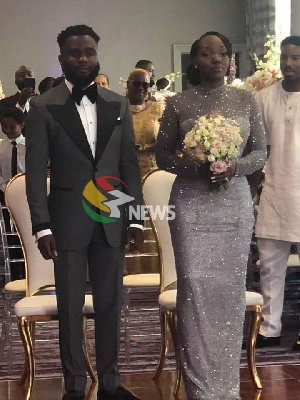 Kofi Mills, son of the late President Atta Mills, with his wife