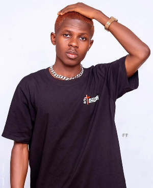 Strongman is captured in an all new look for his 'Status' single