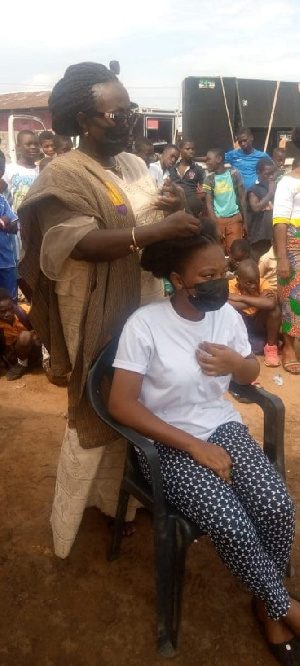 Dzifa Gomashie displaying her skill in hair-making during the launch