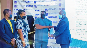 Mr. Nathaniel Johnson (second from right) receiving the award on behalf of Experts Consult Limited