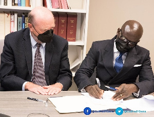 Attorney General, Godfred Dame(R) signing the deal