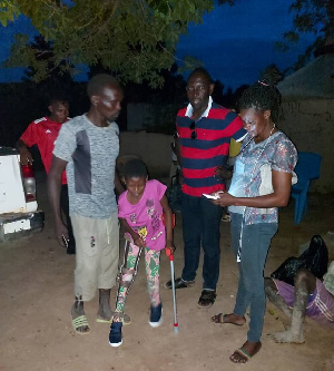 Agnes with some adults after returning from the hospital