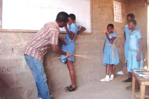 A teacher caning pupils | File photo