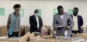 Frank Annoh-Dompreh, the member of Parliament for Nsawam Adoagyiri reading a book