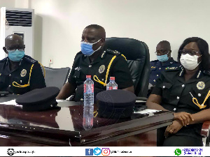 The three national officers who led the visit at a meeting with some officers