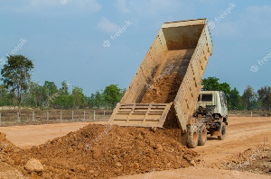 File photo of a truck offloading sand