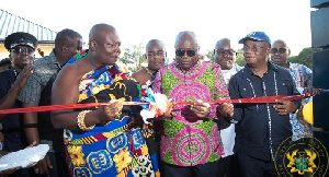 Torgbui Adzonugaga Amenya Fiti (L) and President Nana Akufo-Addo (R) cutting a ribbon