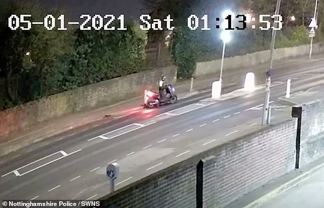 The footage taken on May 1 shows the teen wheeling his bike into the road by two lit bollards