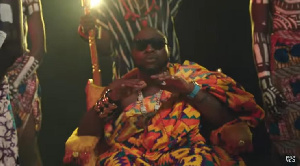 Davido dressed in a Ghanaian kente cloth during a video shoot with Darkovibes