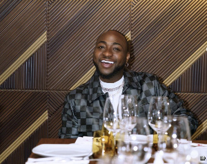 Davido smiles as he cashes in money in 2021