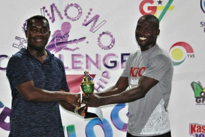 Commeny (right) receives his trophy