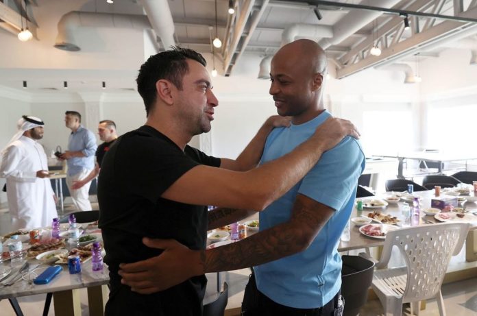 Andre Ayew with Xavi