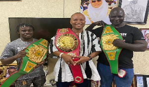The champions in a photograph with their belts