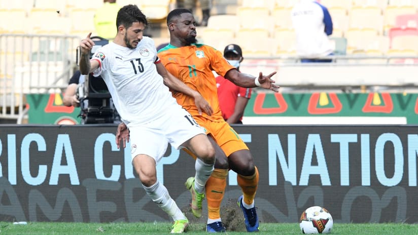 Ahmed El Fotouh of Egypt challenges Serge Aurier of Ivory Coast during the 2021 Africa Cup of Nations Finals Last 16 match between Ivory Coast and Egypt