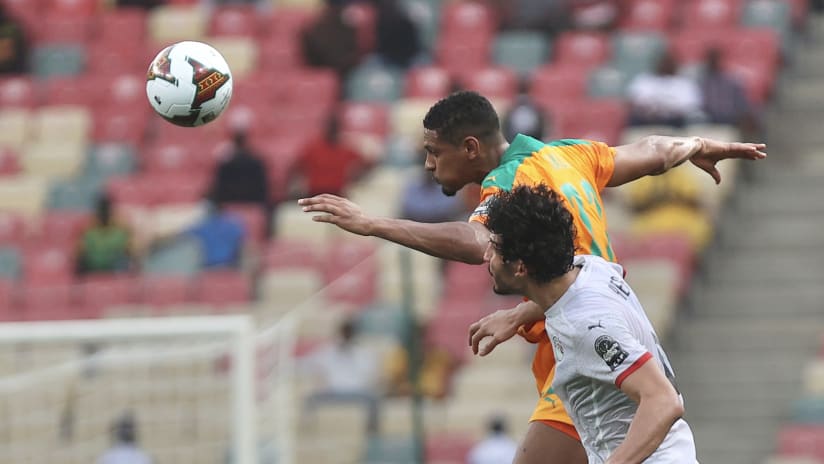 Sebastien Haller of Ivory Coast and Ahmed Hegazy of Egypt challenge for the header during the 2021 Africa Cup of Nations Afcon Finals Last 16 match between Ivory Coast and Egypt