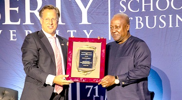 Former President John Mahama (right) being presented with the award by Dr Dave Brat, Dean of the Liberty University School of Business