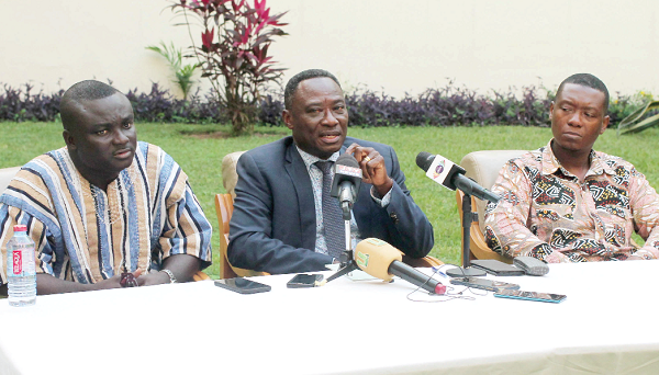 Nana Antwi (middle), Deputy Executive Director, Operations, Economic and Organised Crime Office (EOCO), addressing  the press conference. With him are Edward Cudjoe (right), Director, Administration, EOCO, and Dominic Mensah, Head, Anti-Human Trafficking, EOCO. Picture: Maxwell Ocloo