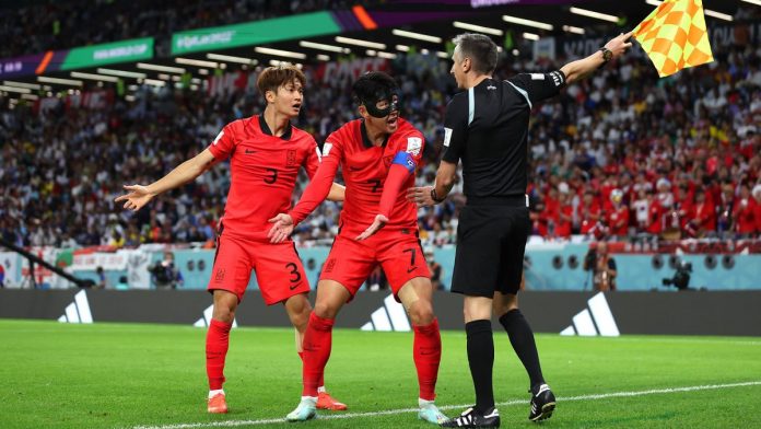 Heungmin Son (C) and Jinsu Kim of Korea Republic argue a call with match officials during the FIFA World Cup Qatar 2022 Group H match between Uruguay and Korea Republic at Education City Stadium Image credit: Getty Images