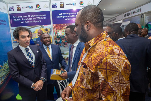Minister of Energy, Dr Mathew Opoku-Prempeh interacting with some officials of Tullow Ghana at the event