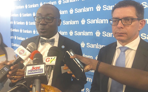 Tawiah Ben -Ahmed (left), CEO of Sanlam Ghana Life Insurance, speaking to the media after the launch. With him is Gavin Downard, Executive, Distribution Support, Sanlam Pan Africa