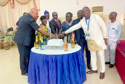  Kwaku Ofori Asiamah (4th right), Minister of Transport, with other freight forwarders cutting the cake to mark the 25th anniversary of the institute