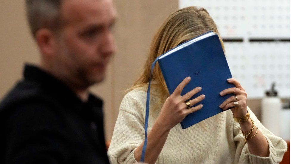At times Ms Paltrow attempted to hide from the cameras in court