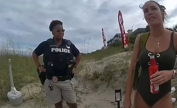 Woman arrested after she was caught moaning while m@sturbating with vibrator on a beach