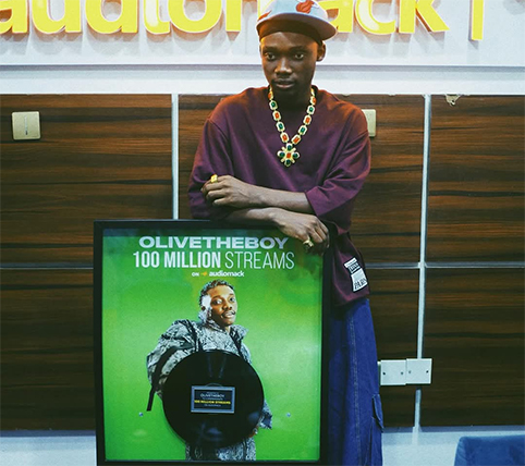 OliveTheBoy Receives Audiomack 100 Million Streams Plaque