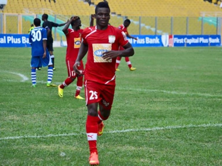 Forner Kotoko striker Amed Toure jubilates after the club fired coach Ogum Narteh