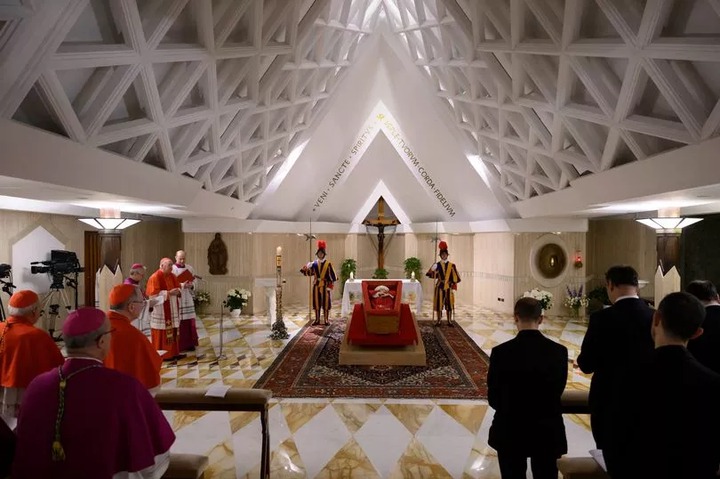 First images of Pope Francis in an open coffin as mourners gather