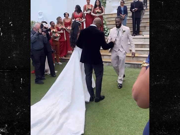 Rapper Ja Rule walks his daughter down the aisle as she marries her heartthrob