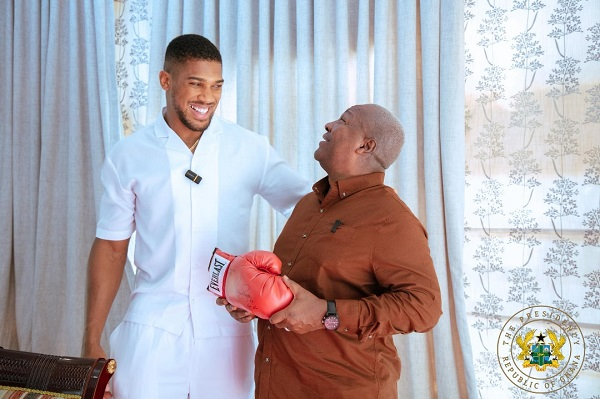 Watch as President Mahama throws playful uppercut at Anthony Joshua